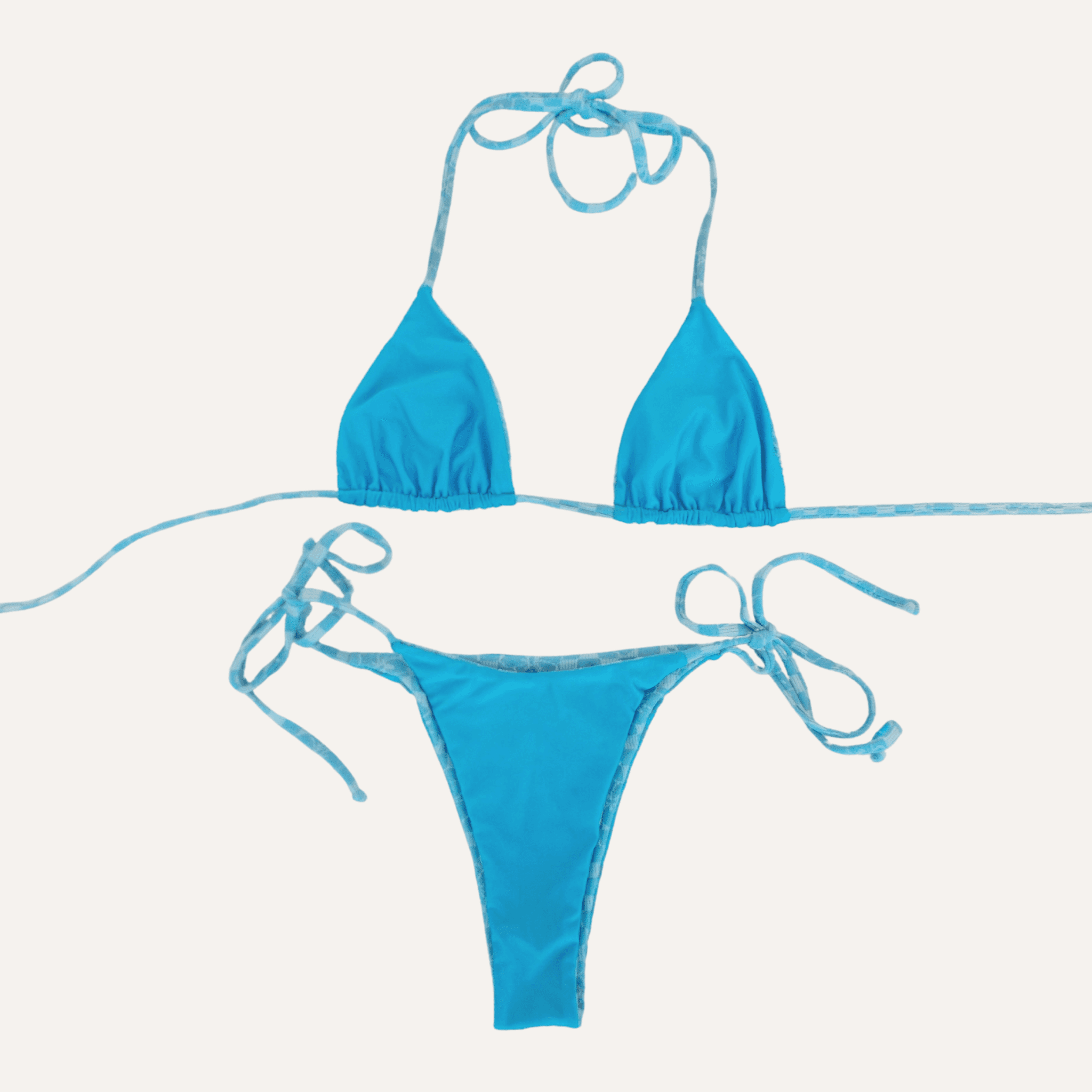 Bright blue two-piece bikini set featuring a triangle halter top with adjustable tie straps and matching low-rise bottoms with side tie closures, designed for a stylish and comfortable beach or poolside look. | PicSEO 1778549027663